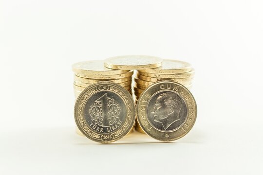 Turkish Lira Coins Stacked on White Background