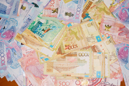 Various Banknotes From Kazakhstan  Displayed on a Surface