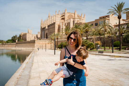 Mother and Toddler Enjoying a Day Near Palma Cathedral