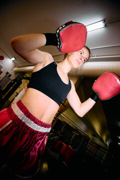 boxer with hook and jab pads during a training