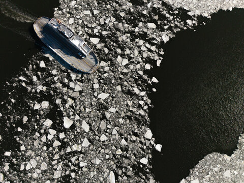 Icebreaking ferry pushing through river