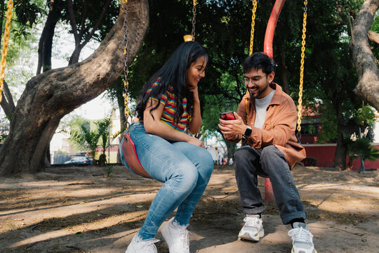 Couple sharing a video on a smartphone