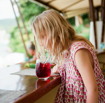 Girl drinking red juice