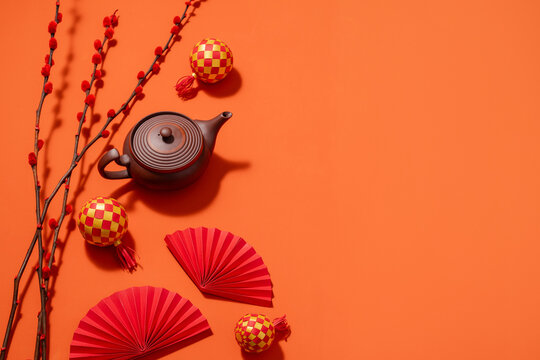 Chinese New Year still life with teapot, decorations