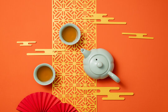 Traditional Chinese tea ceremony with a teapot and cups