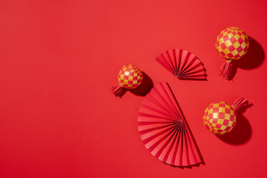 Festive red and yellow decorations arranged on a vibrant red