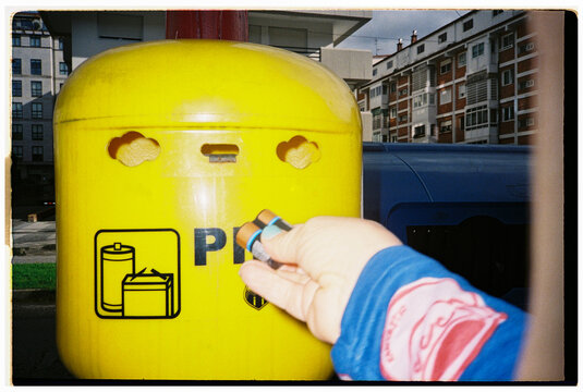 Drops Batteries in City Recycling Bin