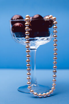Pearl Necklace in Cocktail Glass with Cherries