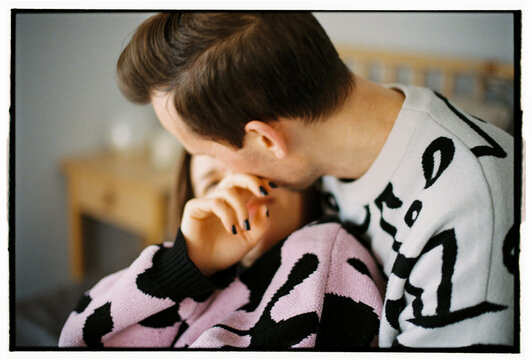 Tender and intimate moment between couple at home