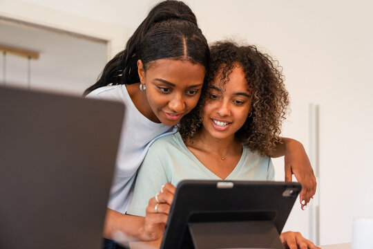 Friends using a tablet in a modern living space