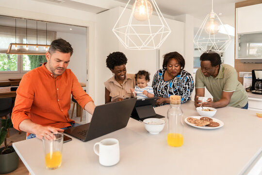 Multigenerational family enjoying time in modern kitchen