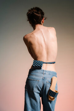 Back View Of Creative Fashion Pose With Denim Jeans