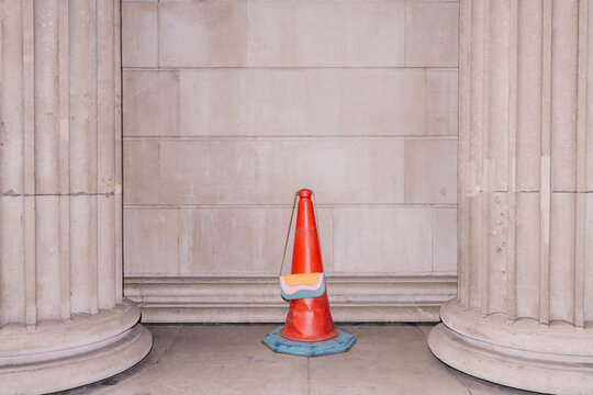 Red Traffic Cone With Multicolor Accessory By Columns