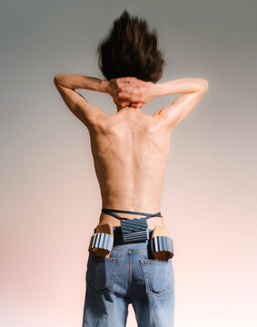 Back View Of Shirtless Person With Tool Belt
