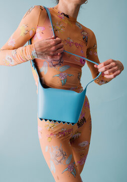 Blue Bag With Floral Bodysuit Accessory