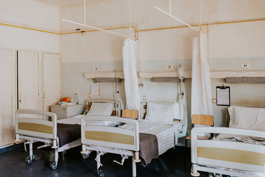 Hospital ward with empty beds and medical equipment
