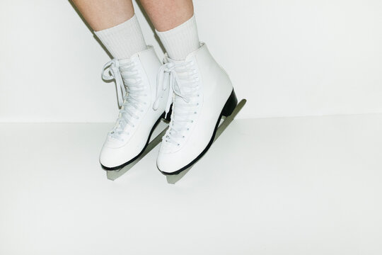 Person wearing winter sport skaters with hard direct flashlight