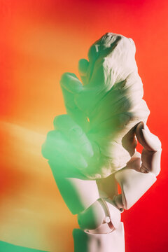 Hand sculpture holding a soft form 