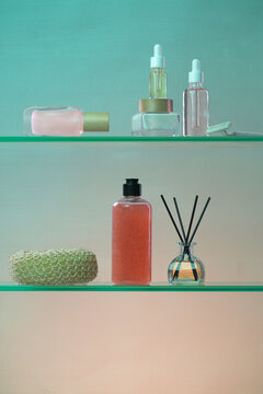 Various skincare and bath products arranged neatly on glass