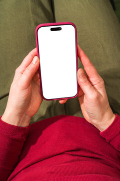 Hands Holding Smartphone with Blank Screen on Lap