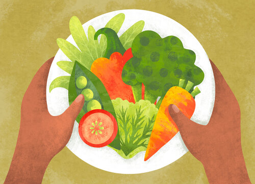 Person holds a plate of fresh vegetables ready for a meal