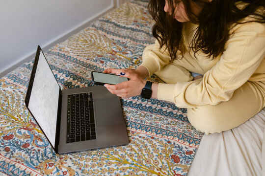 sing Laptop and Phone in a Room