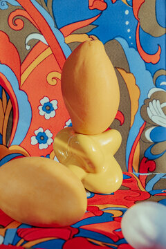Unique arrangement of a yellow object on colorful background