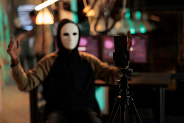 Mobile phone recording internet thief threat video, ransomware attack, anonymous threatening victim. Online scam, cyberattack, cybercrime fraud, malicious software sending © DC Studio
