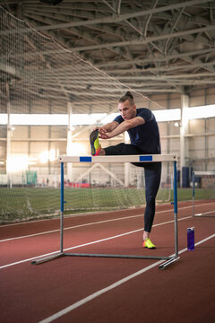 Male runner doing stretching exercise