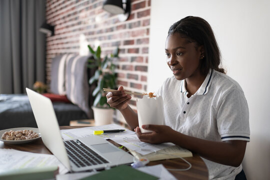 Black student eating Chinese food during break
