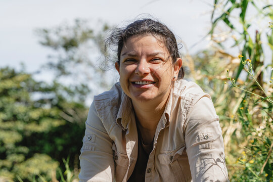 Costa rican woman smiling on a farm portrait