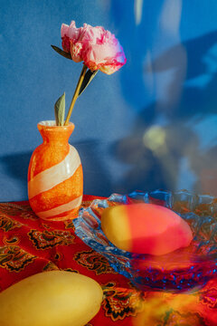 Colorful still life with flowers and fruits on a table