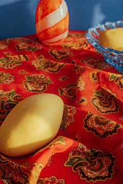 Colors and shapes on a table with fruit and a vase