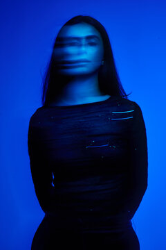 Movement and light blend in blue background with person