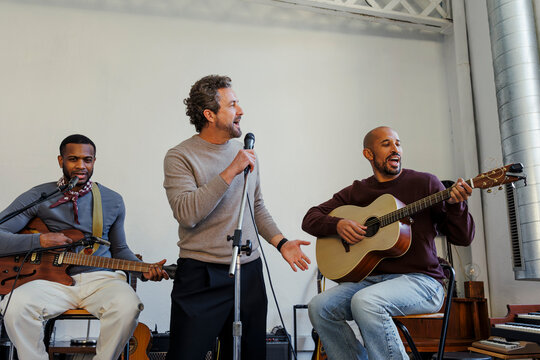 Band performing live music with guitars and vocals