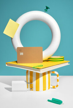 Vibrant Stationery and a Credit Card on Blue and White Background