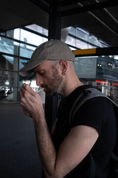Man Smoking at Airport