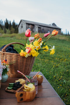 Nordic midsummer picnic with flowers and barn