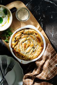 Baked spinach phyllo spiral pie with sesame