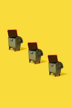 smartphones appear inside trash bins across a yellow background