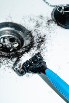close-up of hair on a drain after shaving