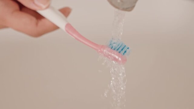 Dawn hygiene ritual. Serene morning ritual of rinsing bristles in warm light. Calm dawn hygiene practice involving gentle brushing and soothing water rinses in peaceful hotel surroundings