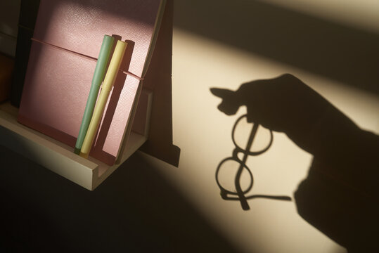 Shadow of woman holding glases
