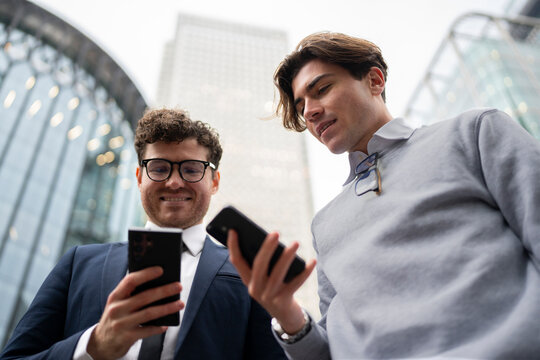 Business Colleagues Checking Smartphones