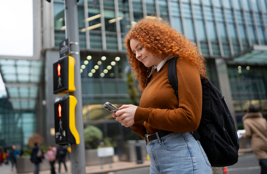 Using Smartphone While Crossing City Street