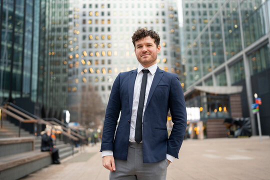 Man in city square, daytime
