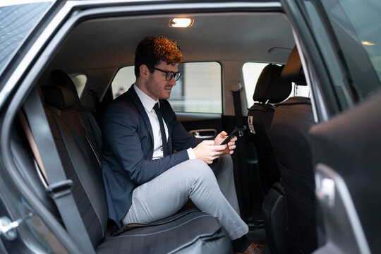Businessman using smartphone while commuting