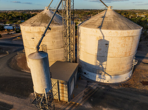 Shadows patterns on the side of rural grain silos and towers