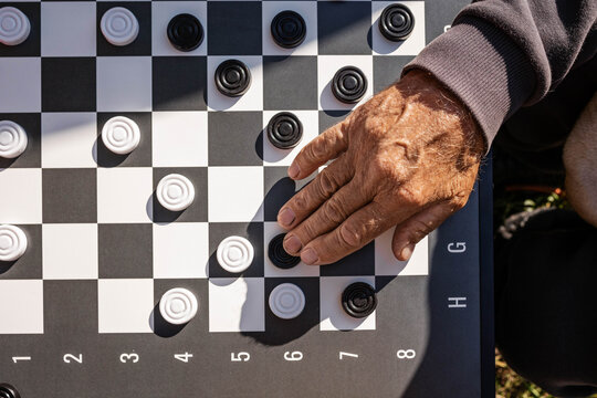 Playing checkers during the day.
