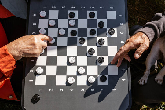 Playing checkers on a sunny day.